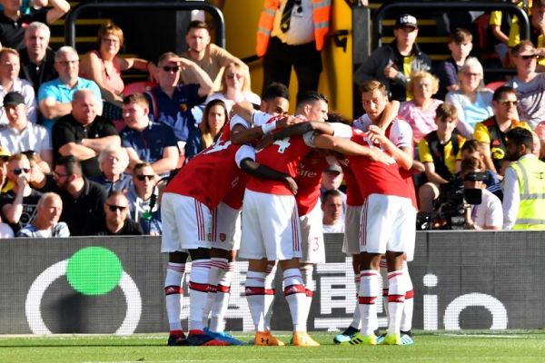 Arsenal's Gabonese striker Pierre-Emerick Aubameyang celebrates with team mates after scoring his team's first goal during the English Premier League football match between Watford and Arsenal at Vicarage Road Stadium in Watford, north of London on September 15, 2019. PHOTO | AFP