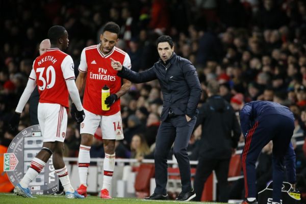Arsenal's Spanish head coach Mikel Arteta (C) gives instructions to Arsenal's English striker Eddie Nketiah (L) and Arsenal's Gabonese striker Pierre-Emerick Aubameyang (2L) on the touchline during the English Premier League football match between Arsenal and Everton at the Emirates Stadium in London on February 23, 2020. PHOTO | AFP