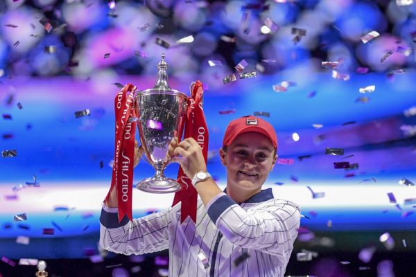 Ashleigh Barty of Australia raises her trophy after winning against Elina Svitolina of Ukraine in their women's singles in the WTA Finals tennis tournament in Shenzhen on November 3, 2019.  PHOTO | AFP