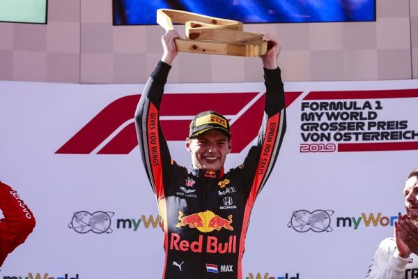Aston Martin Red Bull Racing Honda RB15, portrait celebrating his victory at the podium during the 2019 Formula One World Championship, Grand Prix of Austria from June 27 to 31, in Spielberg, Austria. PHOTO | AFP