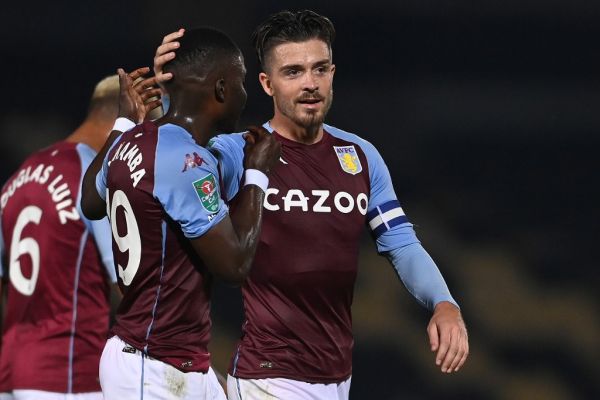 Aston Villa's English midfielder Jack Grealish (R) celebrates scoring his team's second goal with Aston Villa's Zimbabwean midfielder Marvelous Nakamba during the English League Cup second round football match between Burton Albion and Aston Villa at the Pirelli Stadium in Burton-upon-Trent, central England on September 15, 2020. PHOTO | AFP