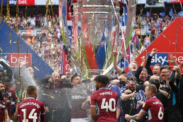 Aston Villa's players celebrate on the pitch after the English Championship play-off final football match between Aston Villa and Derby County at Wembley Stadium in London on May 27, 2019. Aston Villa won the game 2-1, and are promoted to the Premier League. PHOTO | AFP