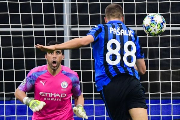 Atalanta's Croatian midfielder Mario Pasalic (R) scores a header past Manchester City's Chilean goalkeeper Claudio Bravo to equalize during the UEFA Champions League Group C football match Atalanta Bergamo vs Manchester City on November 6, 2019 at the San Siro stadium in Milan. PHOTO | AFP