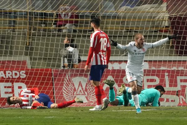 Atletico Madrid's Spanish goalkeeper Antonio Adan (R, down) fails to stop a ball kicked by Cultural Leonesa's Julen Castaneda (not pitured) during the Copa del Rey (King's Cup) football match between Cultural Leonesa and Club Atletico de Madrid at the Reino de Leon stadium in Leon, on January 23, 2020. PHOTO | AFP