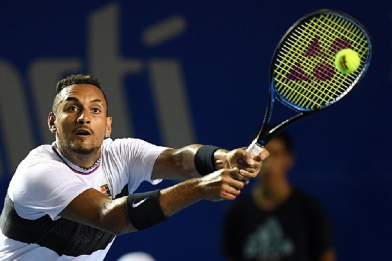 Australian tennis player Nick Kyrgios returns the ball to US tennis player John Isner during their Mexico ATP 500 Open men's single tennis semifinal match in Acapulco, Guerrero state, Mexico on March 1, 2019. PHOTO/GettyImages
