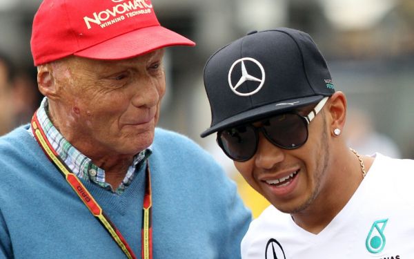 Austrian former formula one racing driver Niki Lauda (L) stands next to Mercedes' British driver Lewis Hamilton (R) at the Monaco street circuit during the first practice session of the Monaco Formula One Grand Prix in Monte Carlo on May 22, 2014. PHOTO | AFP