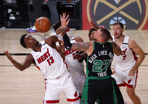 Bam Adebayo #13 of the Miami Heat fights for possession during the third quarter against Daniel Theis #27 of the Boston Celtics in Game Two of the Eastern Conference Finals during the 2020 NBA Playoffs at AdventHealth Arena at the ESPN Wide World Of Sports Complex on September 17, 2020 in Lake Buena Vista, Florida. PHOTO | AFP