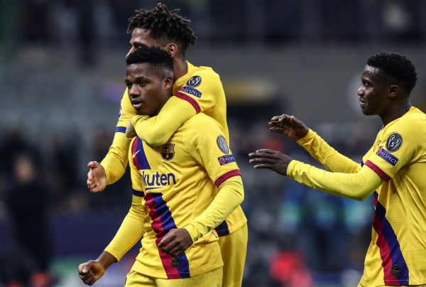 Barcelona´s Guinea-Bissau forward Ansu Fati (L) celebrates after scoring during the UEFA Champions League Group F football match Inter Milan vs Barcelona on December 10, 2019 at the San Siro stadium in Milan.  PHOTO | AFP