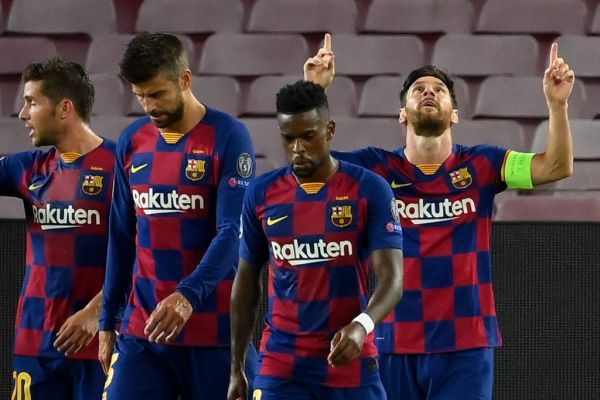 Barcelona's Argentine forward Lionel Messi (R) celebrates with teammates after scoring a goal during the UEFA Champions League round of 16 second leg football match between FC Barcelona and Napoli at the Camp Nou stadium in Barcelona on August 8, 2020. PHOTO | AFP