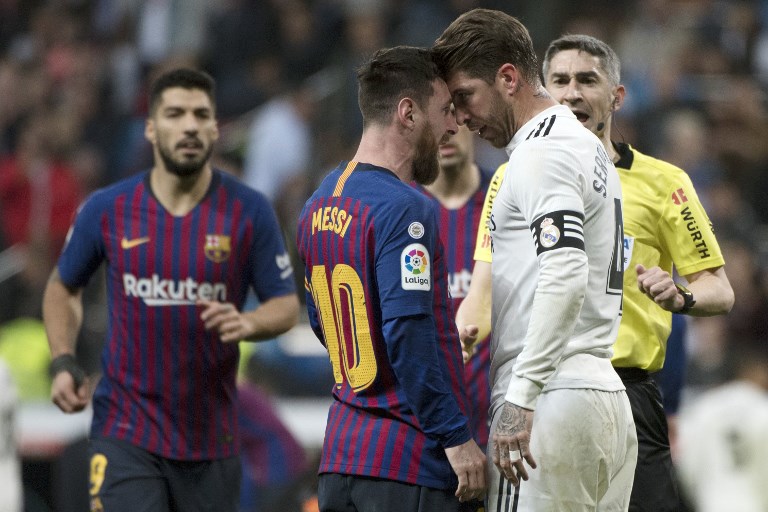 Barcelona's Argentinian forward Lionel Messi (2L) argues with Real Madrid's Spanish defender Sergio Ramos during the Spanish league football match between Real Madrid CF and FC Barcelona at the Santiago Bernabeu stadium in Madrid on March 2, 2019. PHOTO/AFP