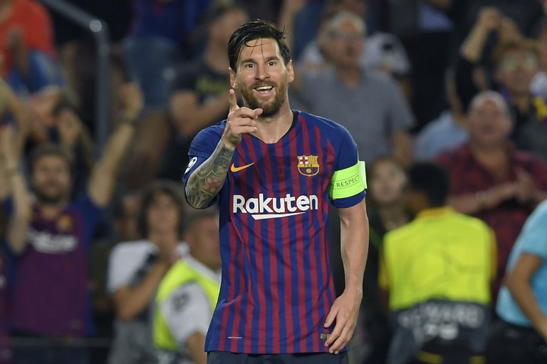 Barcelona's Argentinian forward Lionel Messi celebrates after scoring his third goal during the UEFA Champions' League group B football match FC Barcelona against PSV Eindhoven at the Camp Nou stadium in Barcelona on September 18, 2018. PHOTO/AFP