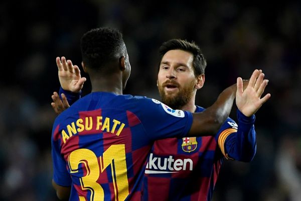 Barcelona's Guinea-Bissau forward Ansu Fati (L) celebrates with Barcelona's Argentine forward Lionel Messi after scoring during the Spanish league football match be tween FC Barcelona and Levante UD at the Camp Nou stadium in Barcelona, on February 2, 2020. PHOTO | AFP