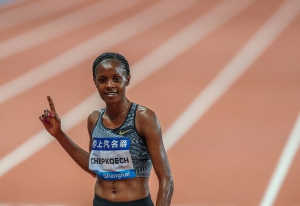 Beatrice Chepkoech of Kenya celebrates after the Women's 3000m Steeplechase of 2019 IAAF Diamond League in east China's Shanghai Municipality on May 18, 2019. Beatrice Chepkoech won the first place in a time of 9:04.53. PHOTO/ AFP