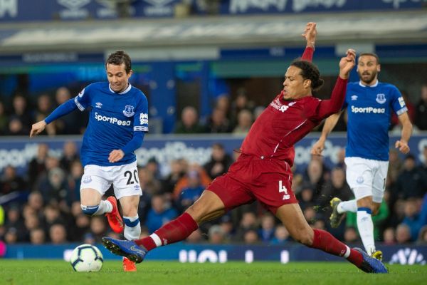 Bernard of Everton FC is tackled by Virgil van Dijk of Liverpool during the Premier League match between Everton and Liverpool at Goodison Park, Liverpool on Sunday 3rd March 2019. PHOTO | AFP