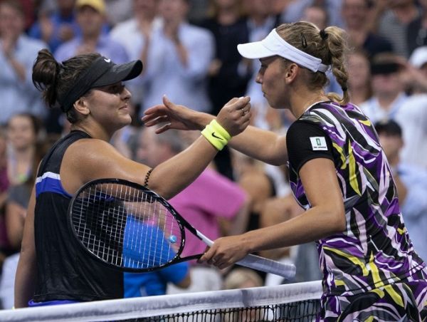 Bianca Andreescu (L) of Canada and Elise Mertens of Belgium meet at the net after their Quarter-finals Women's Singles match at the 2019 US Open at the USTA Billie Jean King National Tennis Center in New York on September 4, 2019. PHOTO | AFP