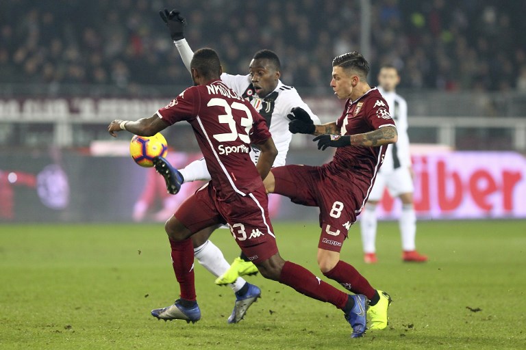 Blaise Matuidi (Juventus FC) and Daniele Baselli (Torino FC) competes for the ball during the Serie A football match between Torino FC and Juventus FC at Olympic Grande Torino Stadium on December 15, 2018 in Turin, Italy. Torino lost 0-1 against Juventus. PHOTO/AFP
