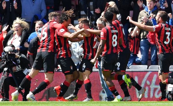 Bournemouth's Dutch defender Nathan Ake (2L) is mobbed by teammates after scoring the opening goal in the closing minutes of the English Premier League football match between Bournemouth and Tottenham Hotspur at the Vitality Stadium in Bournemouth, southern England on May 4, 2019. PHOTO/AFP