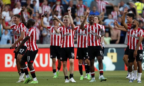 Brentford's players celebrate on the pitch after the English Premier League football match between Brentford and Manchester United at Gtech Community Stadium in London on August 13, 2022. Bentford won the game 4-0. PHOTO | AFP