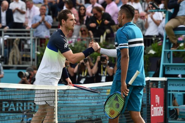 Britain's Andy Murray (L) shakes hands with Australia's Nick Kyrgio after the first round men's singles match at the ATP Queen's Club Championships tennis tournament in west London on June 19, 2018. Britain's Andy Murray was beaten 2-6, 7-6 (7/4), 7-5 by Australian Nick Kyrgios in the Queen's Club first round. PHOTO | AFP