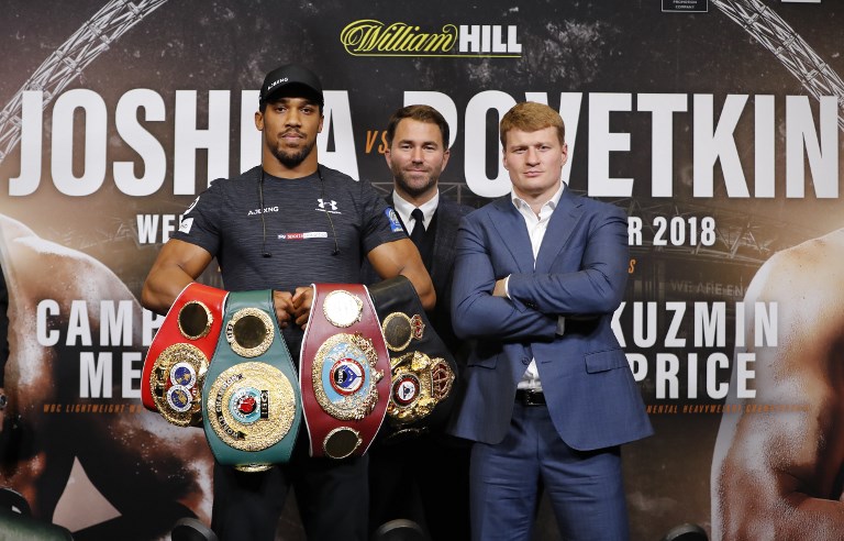 Britain's Anthony Joshua (L) poses by his challenger Russia's Alexander Povetkin during a joint press conference at Wembley stadium in London on September 20, 2018 ahead of the title defence boxing match on Saturday. PHOTO/AFP