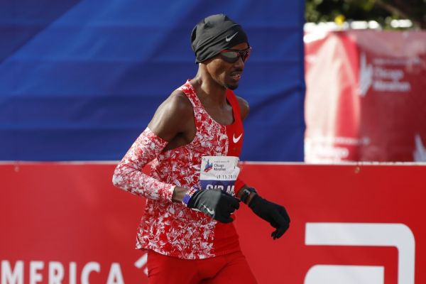 British distance runner Mo Farah crosses the finish line during the 2019 Bank of America Chicago Marathon on October 13, 2019 in Chicago, Illinois. Kenya's Lawrence Cherono won a men's race that came down to the wire in 2:05:45 -- barely edging Ethiopia's Dejene Debela who was second in 2:05:46 with another Ethiopian, Asefa Mengstu, third in 2:05:48. Last year's winner Mo Farah of Britain was never a factor -- finishing a distant eighth in 2:09:58. PHOTO | AFP