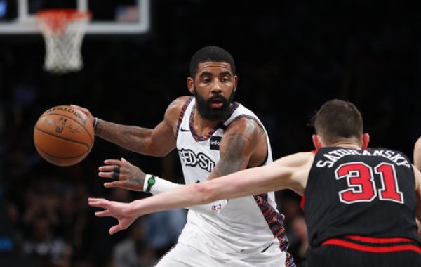 Brooklyn Nets guard Kyrie Irving (11) moves to the basket against Chicago Bulls guard Tomas Satoransky (31) during the second half at Barclays Center. PHOTO | PA Images