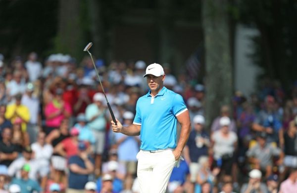 Brooks Koepka reacts to a putt on the 18th green during the final round of the World Golf Championship-FedEx St Jude Invitational at TPC Southwind on July 28, 2019 in Memphis, Tennessee. PHOTO | AFP