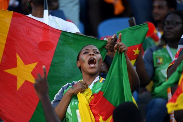 Cameroon fans cheer for their team prior to the 2019 Africa Cup of Nations (CAN) Group F football match between Benin and Cameroon at the Ismailia Stadium in the north-eastern Egyptian city on July 2, 2019. PHOTO | AFP