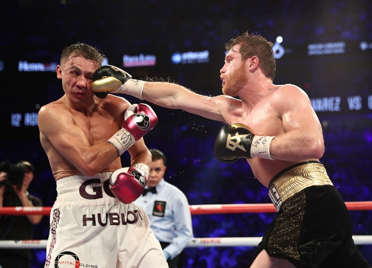 Canelo Alvarez punches Gennady Golovkin during their WBC/WBA middleweight title fight at T-Mobile Arena on September 15, 2018 in Las Vegas, Nevada. PHOTO/AFP