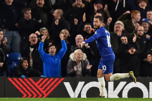 Chelsea's Belgian midfielder Eden Hazard celebrates after scoring their second goal during the English Premier League football match between Chelsea and Brighton and Hove Albion at Stamford Bridge in London on April 3, 2019. PHOTO/AFP