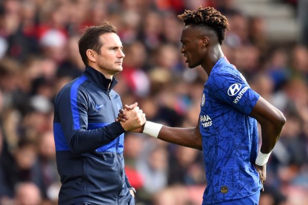 Chelsea's English head coach Frank Lampard (L) shakes hands with Chelsea's English striker Tammy Abraham as he's substituted during the English Premier League football match between Southampton and Chelsea at St Mary's Stadium in Southampton, southern England on October 6, 2019. PHOTO | AFP