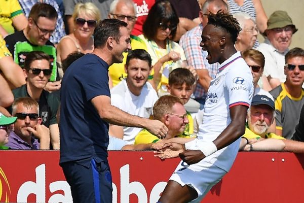 Chelsea's English striker Tammy Abraham (R) runs over to celebrate with Chelsea's English head coach Frank Lampard (L) after scoring the opening goal of the English Premier League football match between Norwich City and Chelsea at Carrow Road in Norwich, eastern England on August 24, 2019. PHOTO | AFP