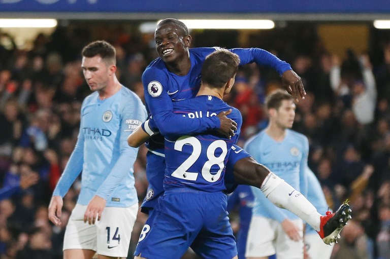 Chelsea's French midfielder N'Golo Kante (C) celebrates with Chelsea's Spanish defender Cesar Azpilicueta afer scoring during the English Premier League football match between Chelsea and Manchester City at Stamford Bridge in London on December 8, 2018.PHOTO / AFP