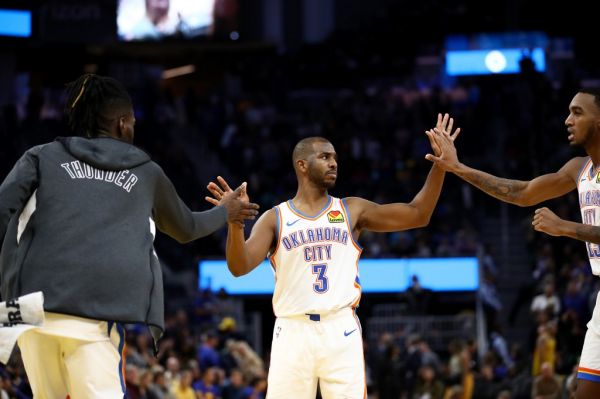 Chris Paul #3 of the Oklahoma City Thunder is congratulated by Nerlens Noel #9 and Terrance Ferguson #23 after they beat the Golden State Warriors at Chase Center on November 25, 2019 in San Francisco, California. PHOTO | AFP