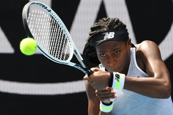 Coco Gauff of the US hits a return against Sofia Kenin of the US during their women's singles match on day seven of the Australian Open tennis tournament in Melbourne on January 26, 2020. PHOTO | AFP