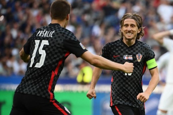 Croatia's midfielder Luka Modric (R) celebrates his team's first goal on a penalty kick with temmates during the UEFA Nations League - League A Group 1 football match between France and Croatia at the Stade de France in Saint-Denis, on the outskirts of Paris on June 13, 2022. PHOTO | AFP