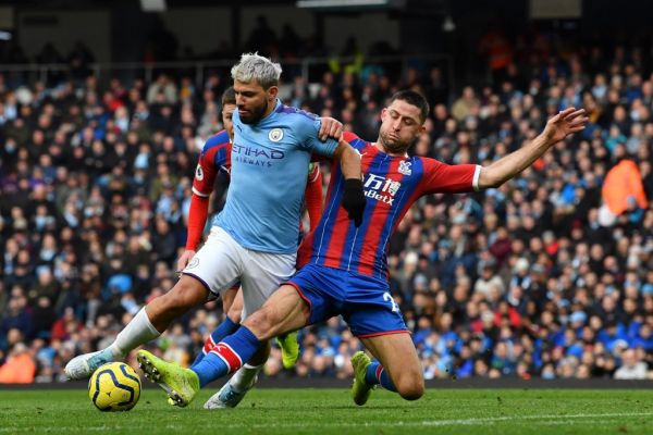 Crystal Palace's English defender Gary Cahill (R) tackles Manchester City's Argentinian striker Sergio Aguero during the English Premier League football match between Manchester City and Crystal Palace at the Etihad Stadium in Manchester, north west England, on January 18, 2020. PHOTO | AFP