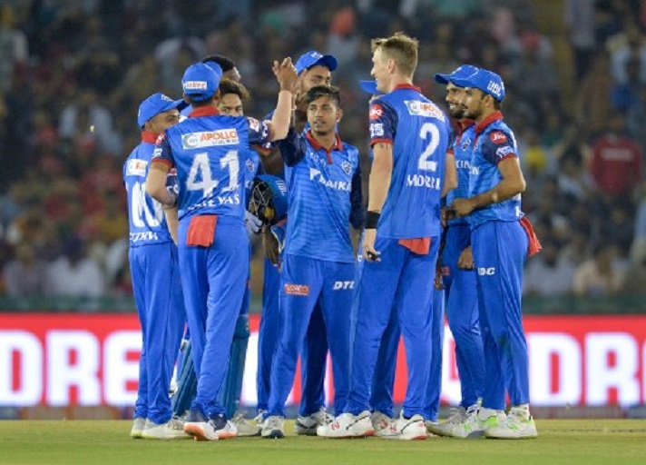 Delhi Capitals bowler Sandeep Lamichhane (C) celebrates with his teammates after he dismissed Kings XI Punjab cricketer Sam Curran during the 2019 Indian Premier League (IPL) Twenty20 cricket match between Kings XI Punjab and Delhi Capitals at the Punjab Cricket Association Stadium in Mohali on April 1, 2019.PHOTO/AFP