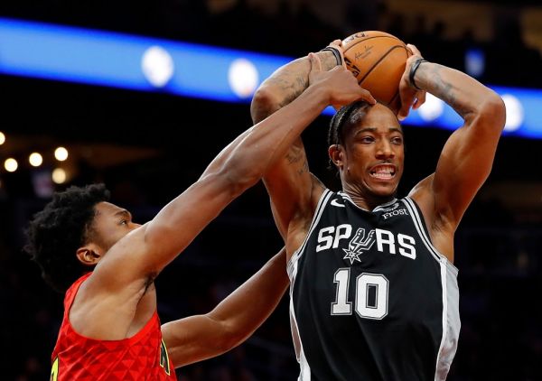 DeMar DeRozan #10 of the San Antonio Spurs drives against Damian Jones #30 of the Atlanta Hawks in the second half at State Farm Arena on November 05, 2019 in Atlanta, Georgia. PHOTO | AFP