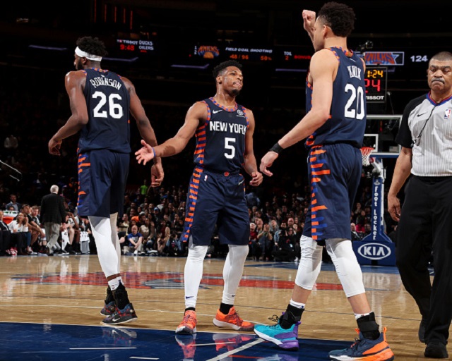 Dennis Smith Jr. #5 of the New York Knicks hi-fives teammates during the game against the San Antonio Spurs on February 24, 2019 at Madison Square Garden in New York City, New York. PHOTO/GettyImages