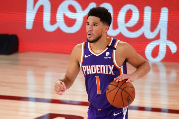 Devin Booker #1 of the Phoenix Suns dribbles downcourt during the game against the LA Clippers at The Arena at ESPN Wide World Of Sports Complex on August 04, 2020 in Lake Buena Vista, Florida. PHOTO | AFP