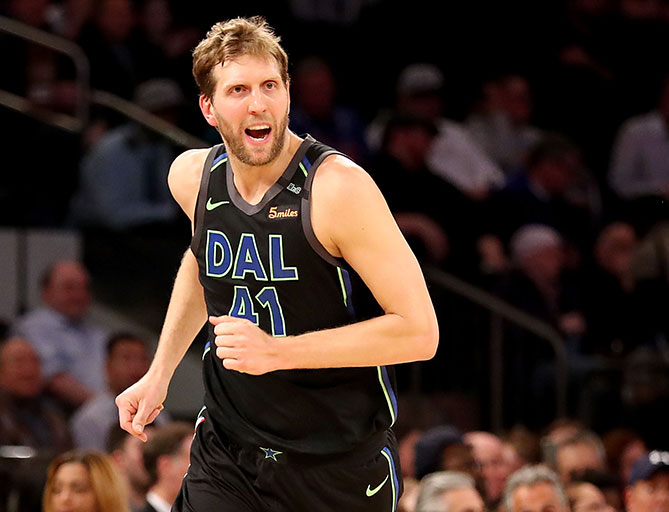 Dirk Nowitzki #41 of the Dallas Mavericks reacting after making a three point shot in the second half against the New York Knicks during their game at Madison Square Garden in New York City. PHOTO/AFP