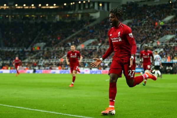 Divock Origi of Liverpool celebrates after scoring a goal to make it 2-3 during the Premier League match between Newcastle United and Liverpool FC at St. James Park on May 4, 2019 in Newcastle upon Tyne, United Kingdom.PHOTO/GETTY IMAGES