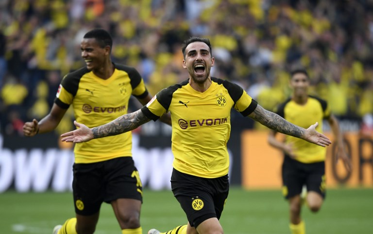 Dortmund's Spanish forward Paco Alcacer and Dortmund's French defender Abdou Diallo (L) celebrate scoring the 4-3 against Augsburg during the German first division Bundesliga football match Borussia Dortmund vs FC Augsburg in Dortmund, western Germany, on October 6, 2018. PHOTO/AFP