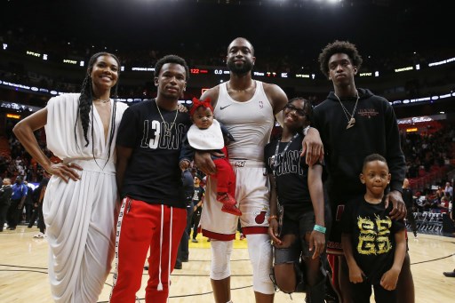 Dwyane Wade (centre) of the Miami Heat poses for a photo with his wife, Gabrielle Union, nephew, Dahveon Morris, and children, Kaavia James Union Wade, Zaire Wade, Xavier Wade and Zion Wade after his final career home game at American Airlines Arena on April 09, 2019 in Miami, Florida. PHOTO/AFP