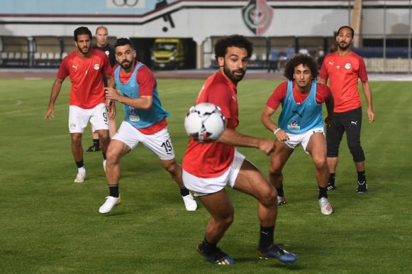 Egypt's forward Mohamed Salah (C) Egypt's defender Abdullah al-Saeed (2nd-L) and Egypt's midfielder Amr Warda (2nd-R) vie for the ball during a training session two days ahead of their opening match against Zimbabwe in the 2019 football Africa Cup of Nations (CAN) on June 19, 2019 at the Cairo Military Academy Stadium in the Egyptian capital. PHOTO/AFP
