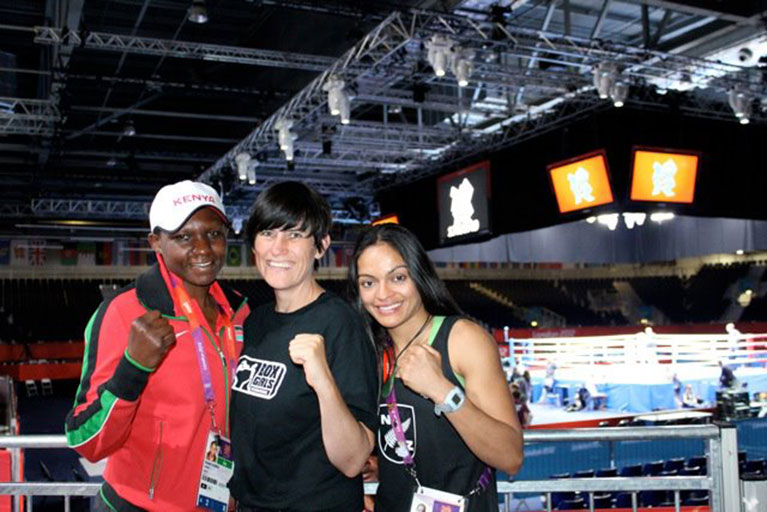 Elizabeth Adhiambo Andiego (left) with boxers Heather Cameron and Fatima Fernandez at the London 2012-Olympics.PHOTO/SPN