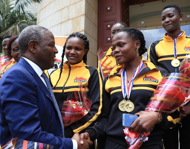 Equity Group Holding Plc Chief Executive and Managing Director, Dr. James Mwangi, congratulates Equity Bank Hawks following their victorious outing at the 2018 FIBA Africa Zone V Clubs Basketball Championships in Dar es Salaam Tanzania on Sunday October 7, 2018.PHOTO/SPN