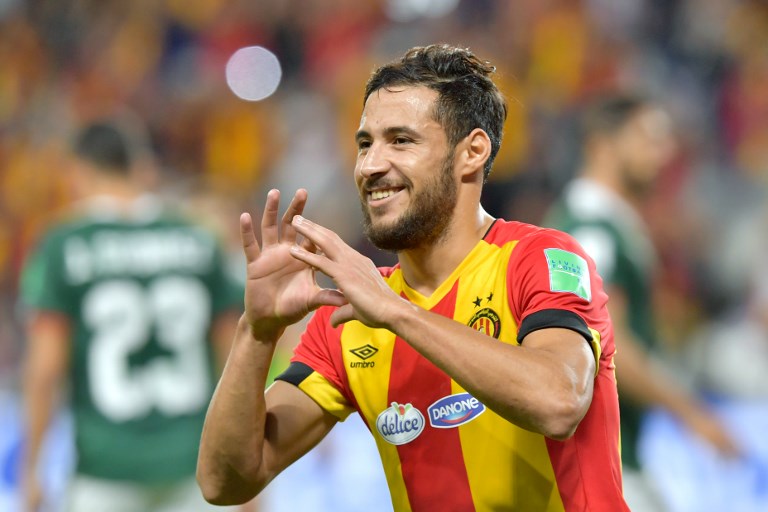 ES Tunis' forward Mohammed Youcef Belaili (R) celebrates after scoring a penalty kick during the fifth place match of the FIFA Club World Cup 2018 football tournament between Tunisia's Esperance Tunis and CD Guadalajara at the Hazza Bin Zayed Stadium in Abu Dhabi, the capital of the United Arab Emirates, on December 18, 2018. 