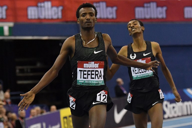 Ethiopia's Samuel Tefera (L) competes to break the indoor world record and win the men's 1500m final ahead of Ethiopia's Yomif Kejelcha at the Indoor athletics Grand Prix at Arena Birmingham in Birmingham on February 16, 2019. PHOTO/AFP